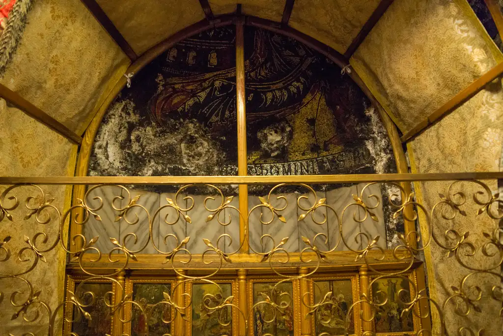 The gilded grille and Crusader mosaic vault above the Grotto of the Nativity.